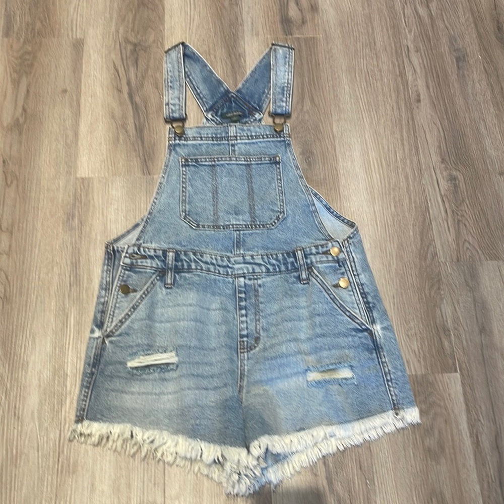 Woman’s distressed denim shorts overalls size small.